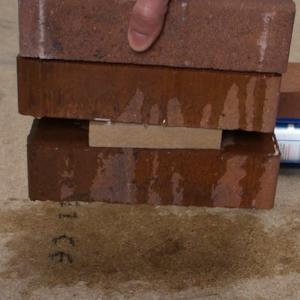 instant grab adhesive grab demonstration with brick